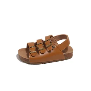 Toddler brown Birkenstock style sandals with adjustable straps and cork sole