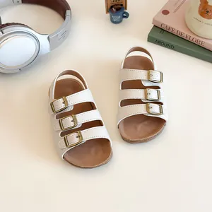 Sandales Birkenstock blanches pour tout-petits avec semelle en liège et boucles en métal
