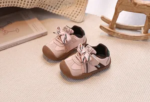 Detail of pink toddler sneakers with mesh upper and protective rubber toe cap