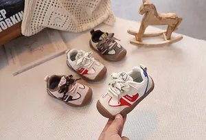 Close-up of colorful toddler walking shoes with protective toes and velcro straps