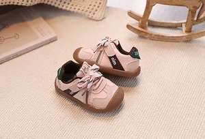 Detailed view of pink toddler walking shoes with breathable mesh and anti-collision toe