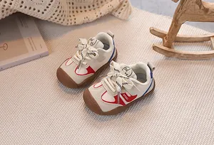 Close-up of toddler sneakers with protective rubber toe cap and leather mesh upper
