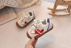 Detailed close-up of baby sport shoes with leather upper and anti-slip rubber sole