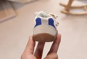 Detail showing the flexible soft sole and reinforced heel of toddler walking shoes