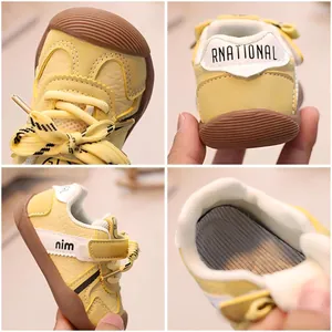Yellow toddler walking shoes with protective toe cap and secure hook-and-loop closure