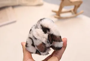 Close-up of leopard print plush material showing soft texture and faux fur detail
