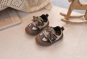 Detailed macro view of baby sneaker with non-slip rubber toe cap and velcro strap