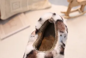 Close-up of warm leopard print faux fur and thick brown plush lining for kids shoes