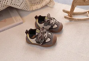 Detailed close-up of leather toddler sneakers featuring anti-collision rubber toe protection