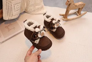 Close-up of baby winter snow boots with plush lining and cute bunny ear decorative detail