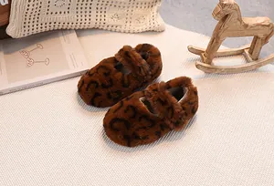 Detailed macro view of soft brown leopard print faux fur baby shoes with Mary Jane strap
