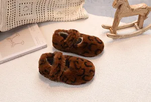 Close-up of leopard print plush baby Mary Jane shoes with cozy faux fur lining and strap