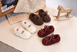 Detailed overhead view of plush Mary Jane shoes with teddy fur and bow accents