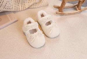 Detailed top view of cozy plush toddler Mary Jane shoes with delicate bow accents