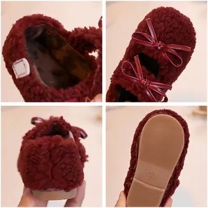 Kids plush bow shoes in burgundy faux fur with anti-slip rubber soles for girls