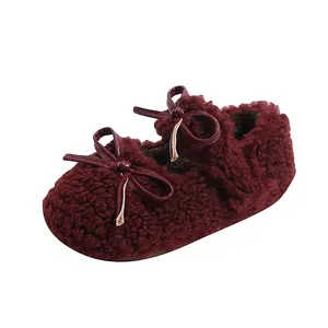 Plush burgundy baby shoes with bow accent and warm fleece lining for winter wear