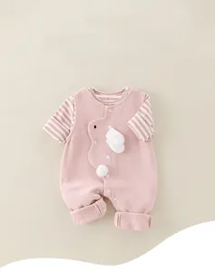 Detail view of pink baby romper with 3D bunny decor and striped long sleeves