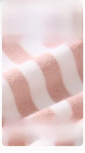 Macro view of pink and white striped soft combed cotton fabric for baby clothes