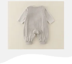 Detail of baby cotton romper back showing soft grey textured fabric and ribbed cuffs