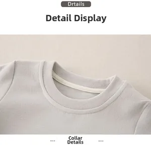 Close-up of the ribbed crew neck on this soft cotton grey baby sweatshirt