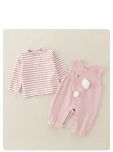 Detailed view of pink baby girl cotton overalls set with cute ruffled stripes and buttons