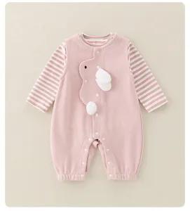 Detail of pink cotton baby bodysuit featuring striped sleeves and 3D plush bunny applique