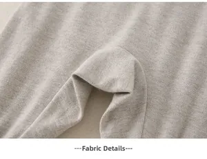 Close-up of soft grey cotton fabric details and premium knit texture of the infant set