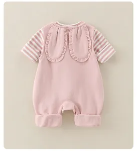 Detailed back view of pink baby romper featuring long bunny ears with ruffled edges