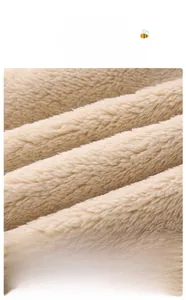 Detail of baby romper with soft khaki ribbed fleece fabric and skin-friendly texture