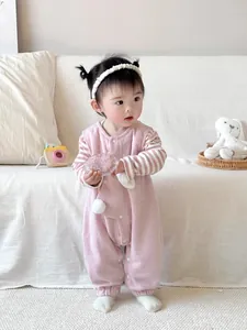 Pink cotton baby girl jumpsuit with white pom-poms and striped sleeves for spring