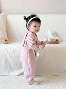 Pink fleece baby jumpsuit set with ruffled back and striped long sleeve shirt