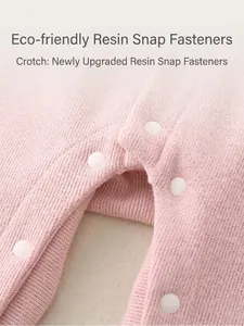 Pink knit baby romper featuring eco-friendly resin snap buttons at the crotch
