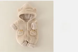 Close-up of baby romper showing soft plush fabric texture and hooded ear details