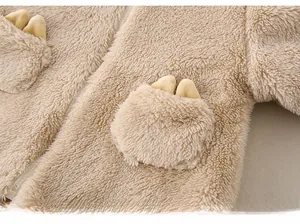 Detail of teddy fleece baby romper with zipper and cute 3D ear decor on pockets