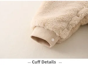 Detail of baby romper leg opening with rib knit cuffs and durable snap closure