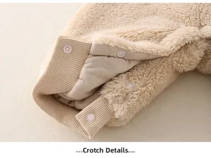 Detail of snap buttons on the soft beige fleece crotch for easy diaper changes