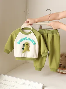 Green infant dinosaur track suit with 3D plush dinosaur accent and elastic cuffs