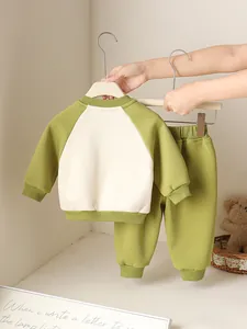 Baby boy autumn 2-piece dinosaur leisure set with green sweatshirt and cream joggers