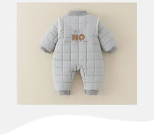 Detail view of the quilted texture and ribbed cuffs on baby winter padded romper