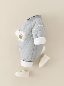Quilted baby romper in light grey with cartoon embroidery and ribbed cuffs on beige