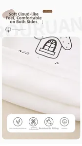 Close-up of soft white fleece fabric with minimalist black house patterns for baby wear