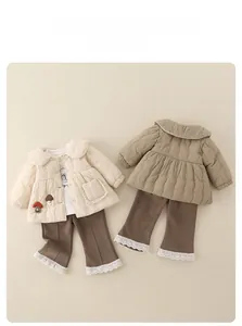 Detail view of toddler girl quilted winter jacket and lace pants set in beige and brown