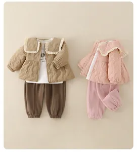 Detailed flat lay of quilted toddler jackets with ruffled collars in pink and khaki