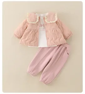 Detailed flat lay of pink quilted cardigan, printed white T-shirt and casual pants set