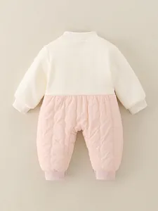 Back view of baby quilted romper in cream rib knit and pink padded fabric