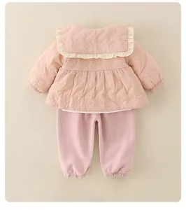 Close-up of pink quilted toddler jacket with large ruffled collar and matching pants