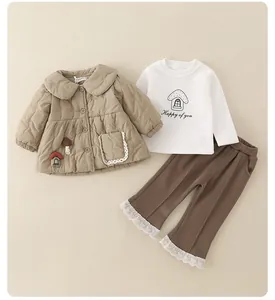 Detail of baby girl winter set with quilted jacket, mushroom print top and lace-trimmed pants