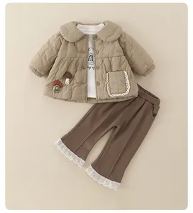 Close-up of baby winter three-piece set with quilted jacket, shirt and lace-edge pants