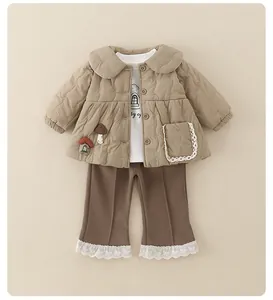 Detail of toddler quilted jacket with mushroom embroidery and lace-trimmed flare pants
