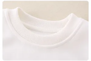 Close-up of white baby top neckline featuring ribbed collar and warm fleece lining